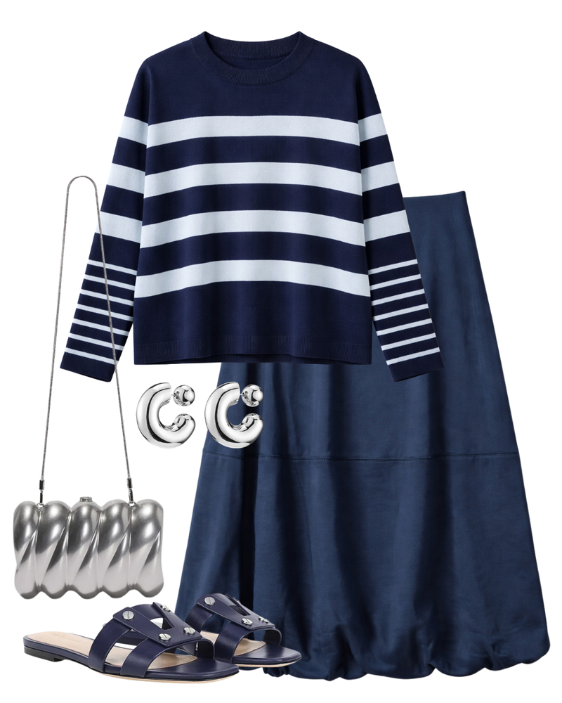 A complete styled outfit consisting of Odette Striped Knit Sweater, Montrose Bubble Skirt in Navy, Reya Silver-Tone Metal Clutch, Via Slide Sandal in Navy, Tome Hoops Medium in High Polish Silver — Shop The Look — AMY Atelier