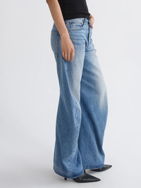 Side view of the Spiral Jean in Venture by AGOLDE, featuring a relaxed wide-leg silhouette in light blue denim