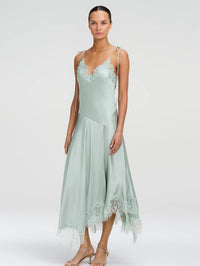 Three-quarter view of the A.L.C. Aleena Dress in Pale Jade showing the paneled hi-low lace hem