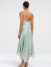 Back view of the A.L.C. Aleena satin slip dress in Pale Jade with low back and lace-trimmed hem