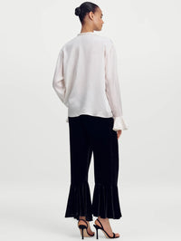 Back full-length view of the A.L.C. Colette Top in Ivory showing the relaxed shape and ruffled sleeve hem.