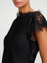 Close-up of the eyelash lace neckline and flutter sleeve on the A.L.C. Luna Top in Black