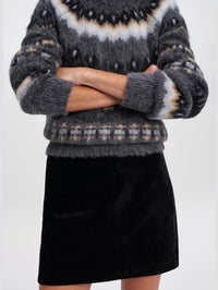 Close-up front view of the A.L.C. Petra Velvet Mini Skirt in Black showing the velvet texture and A-line shape.