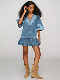 Front view of the Jesse Denim Applique Mini Dress in blue by ALEMAIS with flutter sleeves and ruffle hem