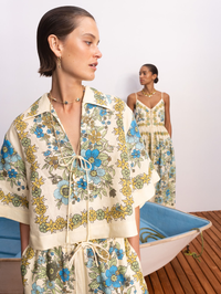 Front view of the Sophia Top in Multi Soph by ALEMAIS, featuring blue and yellow floral print with tie front detail