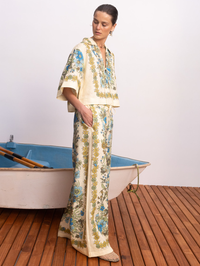 Side view of the Sophia Top in Multi Soph by ALEMAIS, featuring ornate blue and gold floral embroidery