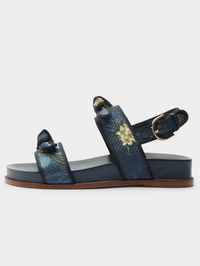 Side view of the Grosgrain Raffia Sport Sandal in Laguna Blue by Alexandre Birman with buckle straps