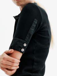 Close-up of the button cuff detail on the Maria Rib Henley Shirt in black by ALL THREE