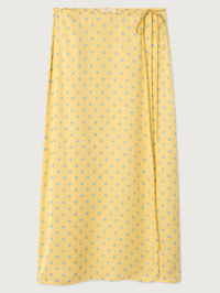 Full view of the Bovalow Skirt in yellow with blue polka dots by American Vintage, styled flat lay