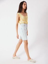 Full-length view of the Bovalow Tank in Marthe yellow by American Vintage, styled with light denim shorts