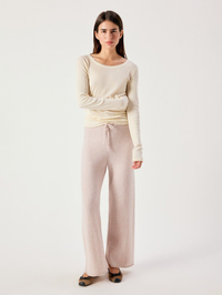 Full-length front view of the Damsville Pant in Poussiere Chine by American Vintage, styled with a cream long-sleeve top