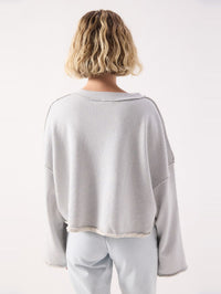 Back view of the American Vintage Dantown Pullover in Melange Sky Blue with wide sleeves
