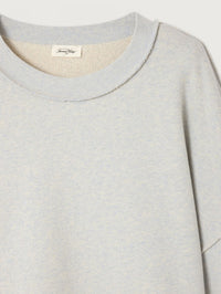 Detail of the raw edge round neckline on the American Vintage Dantown Pullover in Melange Sky Blue