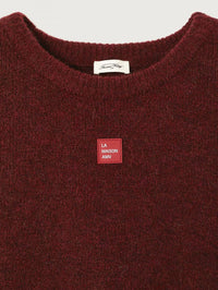 Detail of the La Maison AMV patch on the American Vintage East sweater in Melange Acerola