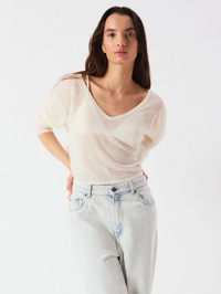 Front view of the Epaky Top in Ecru by American Vintage, styled with light-wash denim