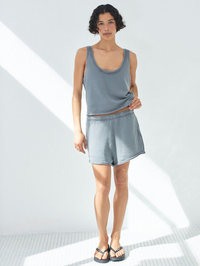 Front view of the Vibtown Tank in Ouragan Vintage by American Vintage, styled with denim shorts