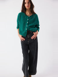 Full length view of the American Vintage Vitow Cardigan in Teal Melange with wide leg dark jeans