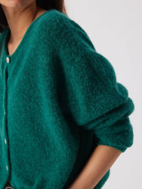 Side detail of the fluffy sleeve and ribbed cuff on the American Vintage Vitow Cardigan in Teal Melange