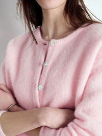 Close up of the pearl effect buttons on the American Vintage Vitow cardigan in Melange Sugared Almond