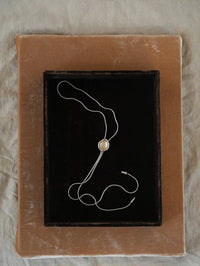 Lolita Bolo in Silver with Citrine on a velvet jewelry tray, BOLOLA NYC.