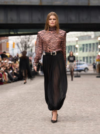 Runway look of the Bronx and Banco Zebra Chiffon High Neck Blouse styled with a sheer black skirt.