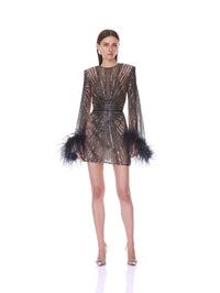 Front pose in the Bronx and Banco navy starburst sequin mini dress with feather cuffs.