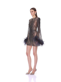 Side view of the Bronx and Banco navy embellished mini dress showing sheer sleeves and feather trim.
