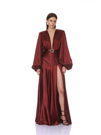 Front pose showing the high slit on the Bronx and Banco burgundy long sleeve V-neck maxi dress.