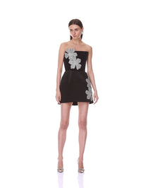 Relaxed front pose in the Bronx and Banco black velvet strapless mini dress with crystal floral appliqués.