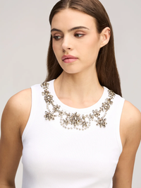 Close-up of crystal floral embellishment at the neckline of the Lizzie Tank in white by Cinq à Sept
