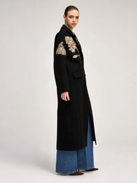 Side view of the Cinq à Sept Gilded Peony Lilienne Coat in Black/gold with gold peonies at the shoulder
