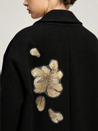 Back detail of the gold embroidered peony on the Cinq à Sept Lilienne Coat in Black/gold
