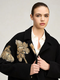 Upper body view of the Cinq à Sept Gilded Peony Lilienne Coat in Black/gold showing the notch lapel