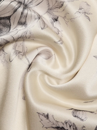 Close-up of hand-sketched floral print on the creamy gardenia fabric of the Jett Dress by Cinq à Sept