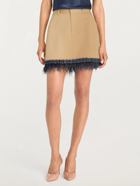 Front view of the Marie Skirt in khaki with navy feather hem by Cinq à Sept