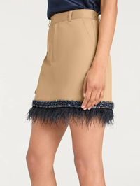 Side view of the Marie Skirt in khaki with navy feather trim by Cinq à Sept