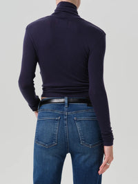 Back view of the Citizens of Humanity Caradene Turtleneck in Navy showing the close fit.
