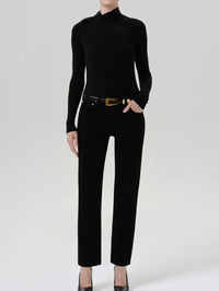 Full length view of the Citizens of Humanity Sculptural Bodysuit in Black styled with black jeans.