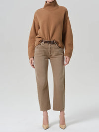 Front view of the Citizens of Humanity Winslow Cropped 27 Jean in Tan with a camel turtleneck and nude pumps.