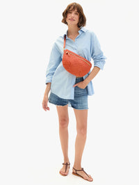 Front view of the Grande Fanny In Medium Woven Diagonal in Saltillo by CLARE V., styled as a crossbody bag