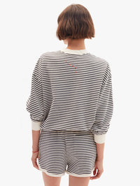 Back view of the Oversized Sweatshirt in Black/Cream Stripes by Clare V. with coordinating striped shorts