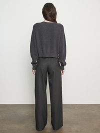 Back view of the Cotton Cashmere Raglan Sweater in charcoal by Enza Costa, styled with black trousers