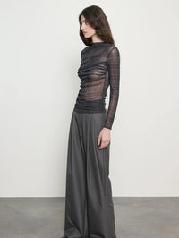 Side view of the Enza Costa Plaid Mesh Long Sleeve Twist Top in Shadow Plaid showing the ruching and high neck.