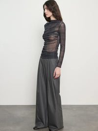 Side view of the ENZA COSTA Plaid Mesh Long Sleeve Twist Top in Shadow Plaid showing the high neckline.