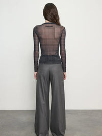 Back view of the Enza Costa Plaid Mesh Long Sleeve Twist Top in Shadow Plaid, sheer through the back.
