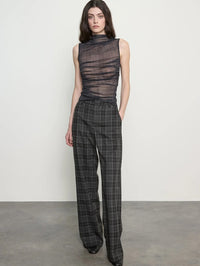 Front view of the Enza Costa Plaid Mesh Sleeveless Twist Top in Shadow Plaid with plaid wide-leg trousers.