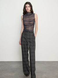 Full front view of the Enza Costa Plaid Mesh Sleeveless Twist Top in Shadow Plaid with plaid wide leg trousers.