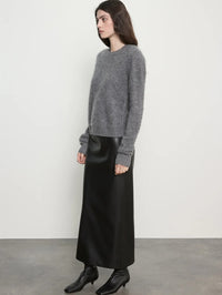 Side view of the Enza Costa Mink Wash Cashmere Easy Crew in Pewter showing the relaxed sleeve and hem.