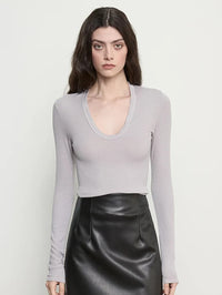 Close front view of the Enza Costa Fluid Silk Rib Essential U Top in Light Grey with its soft U neckline.