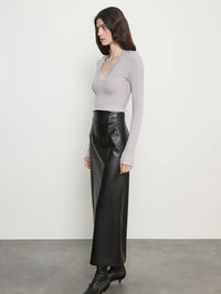 Side view of the Enza Costa Fluid Silk Rib Essential U Top in Light Grey showing the U neckline and long sleeves.